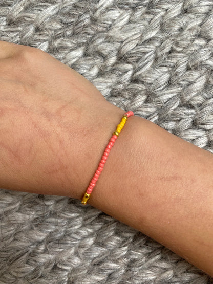 Storm 4 - Seed Bead Bracelet on elastic - Coral, Yellow & Gold