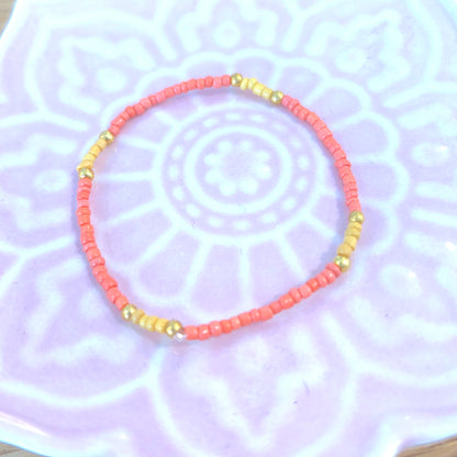 Storm 4 - Seed Bead Bracelet on elastic - Coral, Yellow & Gold